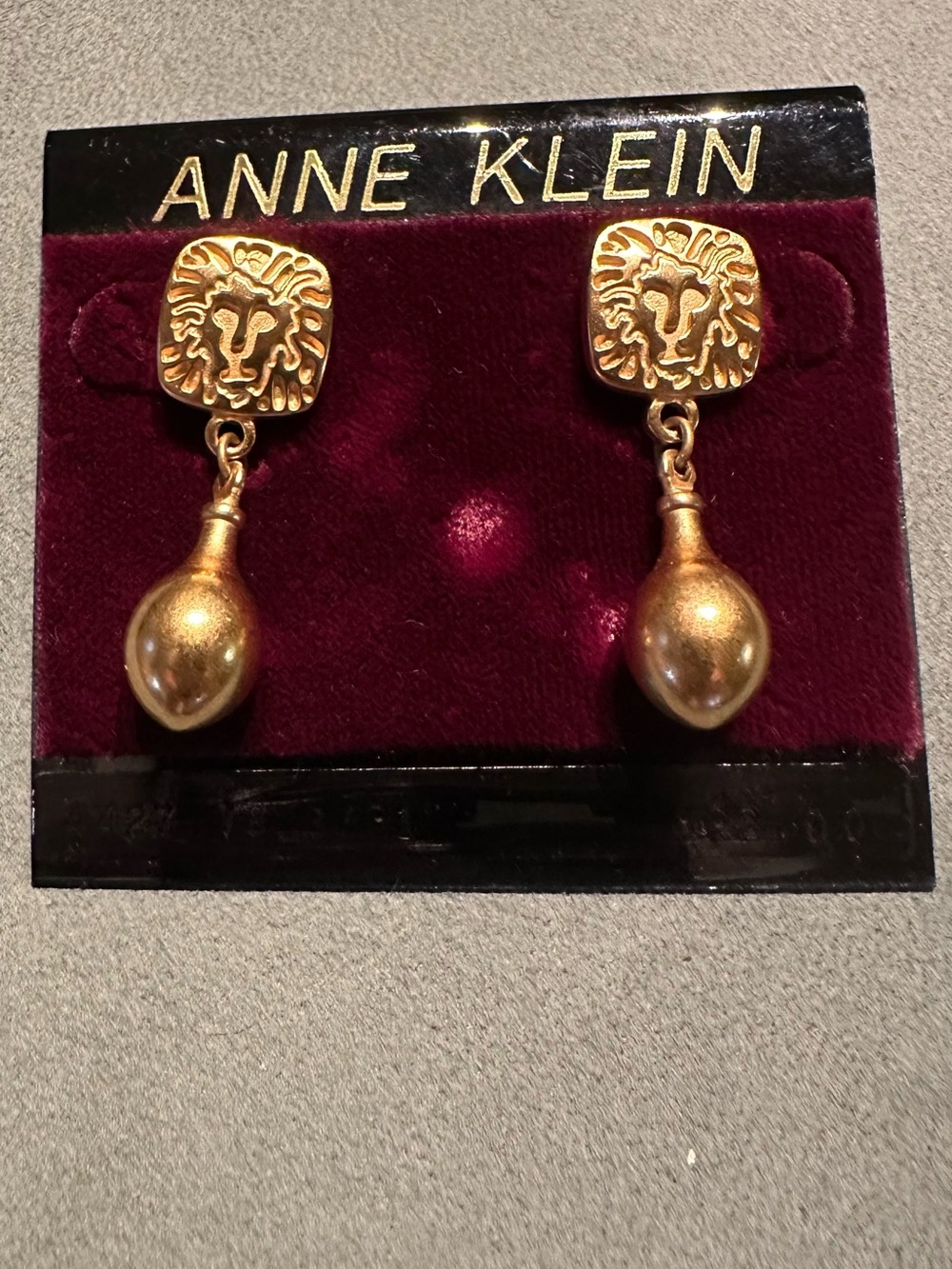 Anne Klein Gold Lion Head Drop Earrings with Teardrop Pendants